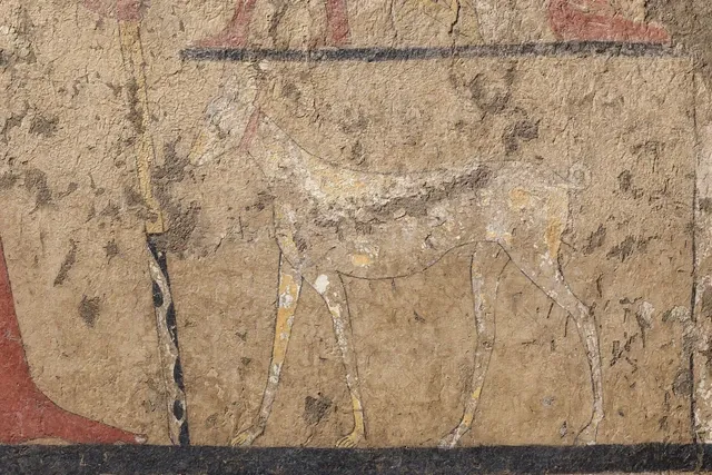 Greyhound history, a pale long-legged hound painted beside a man in the tomb of Iti, Gebelein, Egypt, about 2000 BC