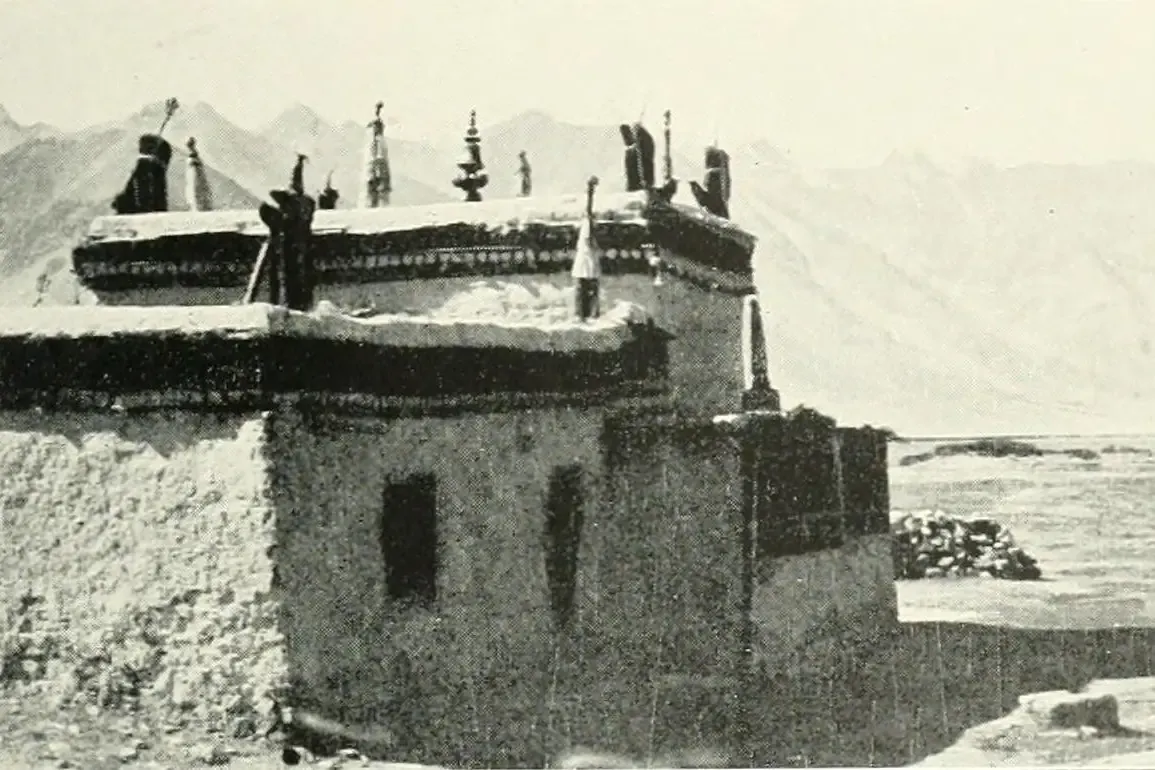 Lhasa Apso history, a whitewashed monastery building with mountains behind, Tibet, 1909